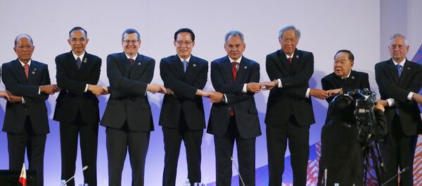 Representatives link arms during a brief photo session at the start of the ASEAN Defense Ministers' Meeting and its Dialogue Partners in Clark, Pampanga province, north of Manila, Philippines Representatives link arms during a brief photo session at the start of the ASEAN Defense Ministers' Meeting and its Dialogue Partners in Clark, Pampanga province, north of Manila, Philippines - Sputnik International