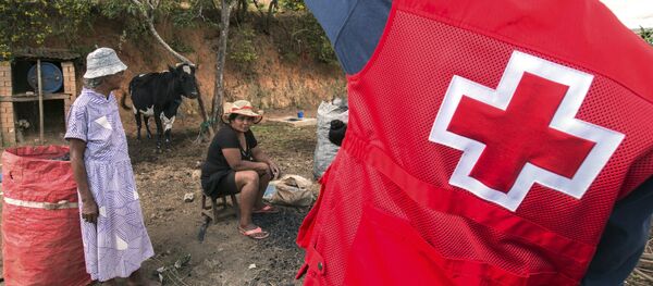 Red Cross volunteers speak to educating villagers about the plague outbreak, 30 miles west of Antananarivo, Madagascar, Monday, Oct. 16, 2017 Red Cross volunteers speak to educating villagers about the plague outbreak, 30 miles west of Antananarivo, Madagascar, Monday, Oct. 16, 2017 - Sputnik International
