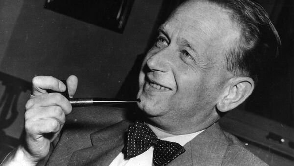 In this May 19, 1953 file photo, Dag Hammarskjold, recently appointed secretary general of the United Nations who is on a visit to Sweden, smokes his pipe at a press conference held at the Foreign Office in Stockholm. - Sputnik International