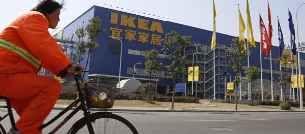 A public worker rides a bicycle in front of an Ikea shop Wednesday March 6, 2013 in Shanghai, China. Chinese authorities say they have destroyed nearly two tons of chocolate cake imported by Sweden's Ikea for violating food quality standards. A public worker rides a bicycle in front of an Ikea shop Wednesday March 6, 2013 in Shanghai, China. Chinese authorities say they have destroyed nearly two tons of chocolate cake imported by Sweden's Ikea for violating food quality standards. - Sputnik International