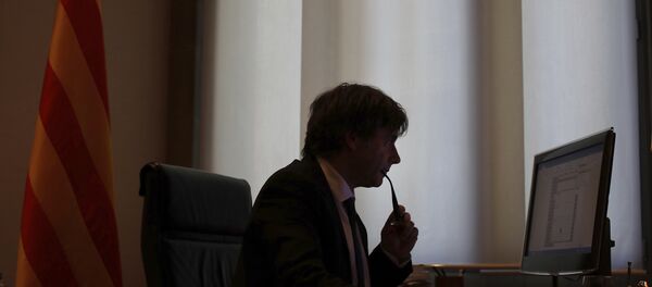Catalan regional President Carles Puigdemont works on his speech at his desk inside the Palau de la Generalitat in Barcelona, Spain, Tuesday Oct. 10, 2017, which is the seat of the Catalan government. Catalan regional President Carles Puigdemont works on his speech at his desk inside the Palau de la Generalitat in Barcelona, Spain, Tuesday Oct. 10, 2017, which is the seat of the Catalan government. - Sputnik International