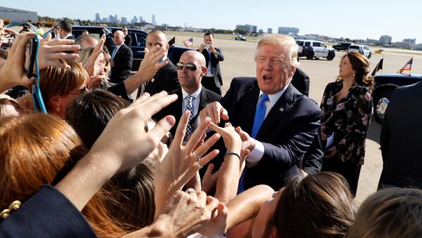 U.S. President Donald Trump greets well wishers upon his arrival at Dallas Love Field in Dallas, Texas, U.S, October 25, 2017 - Sputnik International