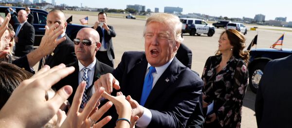 U.S. President Donald Trump greets well wishers upon his arrival at Dallas Love Field in Dallas, Texas, U.S, October 25, 2017 U.S. President Donald Trump greets well wishers upon his arrival at Dallas Love Field in Dallas, Texas, U.S, October 25, 2017 - Sputnik International