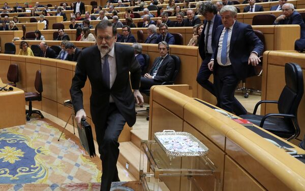 Spain's Prime Minister Mariano Rajoy leaves his seat during a debate at the upper house Senate in Madrid, Spain, October 27, 2017 - Sputnik International