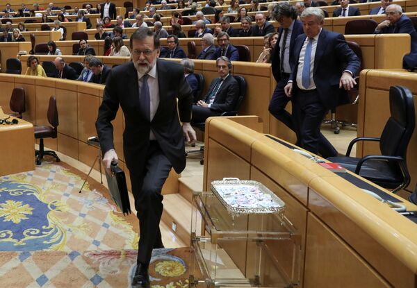 Spain's Prime Minister Mariano Rajoy leaves his seat during a debate at the upper house Senate in Madrid, Spain, October 27, 2017 Spain's Prime Minister Mariano Rajoy leaves his seat during a debate at the upper house Senate in Madrid, Spain, October 27, 2017 - Sputnik International