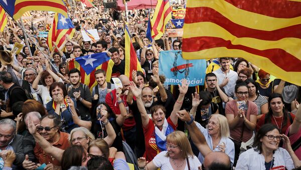 People celebrate after Catalonia's parliament voted to declare independence from Spain on October 27, 2017 in Barcelona - Sputnik International