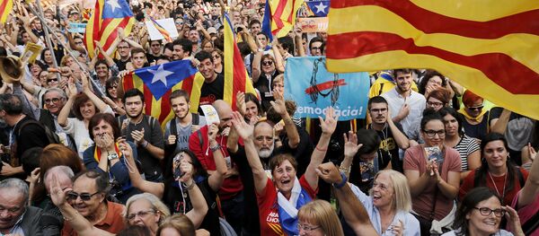 People celebrate after Catalonia's parliament voted to declare independence from Spain on October 27, 2017 in Barcelona - Sputnik International
