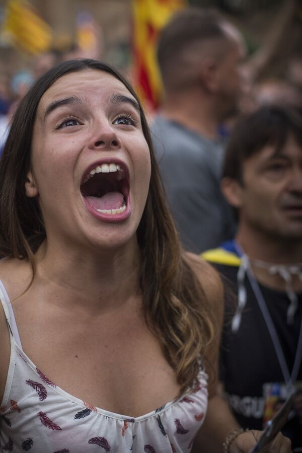 Independence supporter crying out in excitement over the Catalan Parliament's declaration of independence. Independence supporter crying out in excitement over the Catalan Parliament's declaration of independence. - Sputnik International