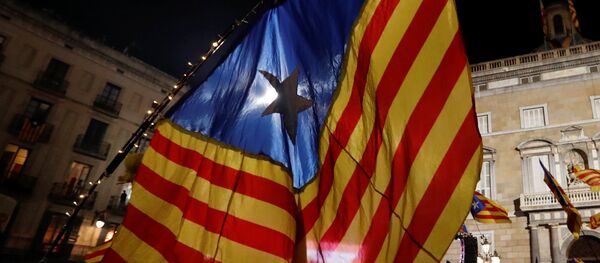 People celebrate and wave Catalan separatist flags in Sant Jaume square after the Catalan regional parliament declared independence from Spain in Barcelona, Spain, October 27, 2017 People celebrate and wave Catalan separatist flags in Sant Jaume square after the Catalan regional parliament declared independence from Spain in Barcelona, Spain, October 27, 2017 - Sputnik International