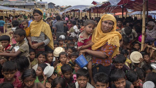 Rohingya Muslims, who crossed over from Myanmar into Bangladesh, wait for their turn to receive food handouts distributed to children and women by a Turkish aid agency at Thaingkhali refugee camp, Bangladesh, Saturday, Oct. 21, 2017 - Sputnik International