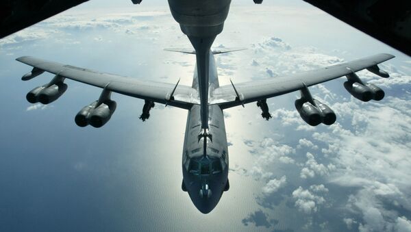 A US Air Force B-52 bomber returning from a mission over Iraq is refueling from a KC-10 plane over the Black Sea, in this Friday, March 28, 2003 photo - Sputnik International