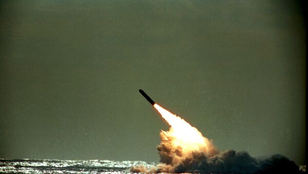 Dec. 4, 1989 file photo shows the launch of a Trident II, D-5 missile from the submerged USS Tennessee submarine in the Atlantic Ocean off the coast of Florida. As of mid-2010, 12 operational U.S. nuclear-missile submarines carry a total of 288 Trident missiles. A movement is growing worldwide to abolish nuclear weapons, encouraged by President Barack Obama's endorsement of that goal. But realists argue that more stability and peace must first be achieved in the world. - Sputnik International