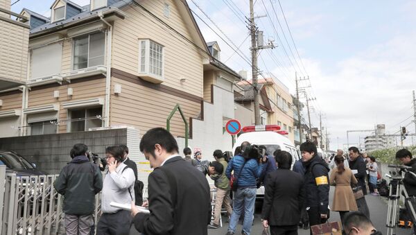 Members of the media gather in front of an apartment building where media reported nine bodies were found in Zama, Kanagawa Prefecture, Japan in this photo taken by Kyodo on October 31, 2017 - Sputnik International