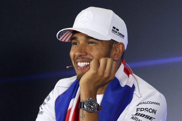 Lewis Hamilton smiles in a news conference after winning the World Championship Lewis Hamilton smiles in a news conference after winning the World Championship - Sputnik International