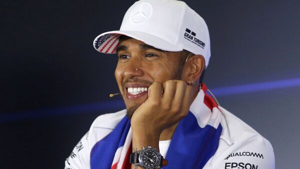 Lewis Hamilton smiles in a news conference after winning the World Championship - Sputnik International