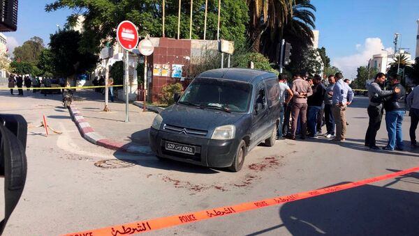 Police officer are pictured where a suspected Islamist militant was arrested after wounding two policemen in a knife attack near the parliament building in Tunis, Tunisia November 1, 2017 - Sputnik International