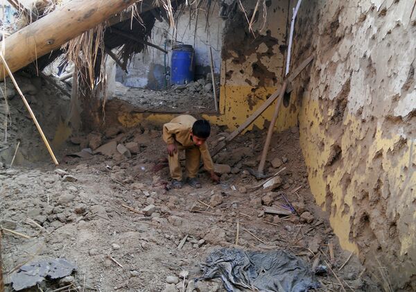 A Pakistani child sifts through rubble at a destroyed religious seminary belonging to the Haqqani network after a US drone strike in the Hangu district of Khyber Pakhtunkhwa province. (File) A Pakistani child sifts through rubble at a destroyed religious seminary belonging to the Haqqani network after a US drone strike in the Hangu district of Khyber Pakhtunkhwa province. (File) - Sputnik International