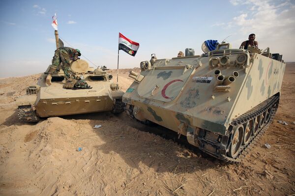 Iraqi forces and members of the Hashed al-Shaabi (Popular Mobilisation units) advance towards the city of al-Qaim, in western Anbar province, on the Syrian border as they fight against remnant pockets of Islamic State group jihadists on November 2, 2017 Iraqi forces and members of the Hashed al-Shaabi (Popular Mobilisation units) advance towards the city of al-Qaim, in western Anbar province, on the Syrian border as they fight against remnant pockets of Islamic State group jihadists on November 2, 2017 - Sputnik International