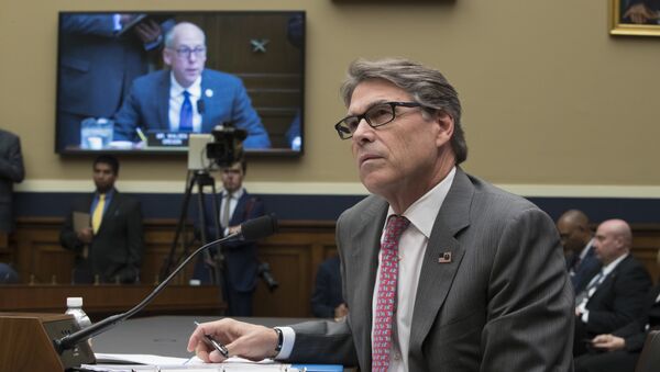 Energy Secretary Rick Perry listens to a statement by Energy and Commerce Committee Chairman Greg Walden, R-Ore., on TV monitor, during a hearing about the electrical grid, on Capitol Hill in Washington, Thursday, Oct. 12, 2017 - Sputnik International