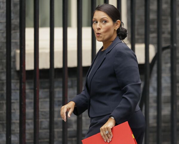Britain's Secretary of State for International Development Priti Patel reacts to a question from the media as she arrives for a cabinet meeting at 10 Downing Street in London, Tuesday, Oct. 10, 2017. Britain's Secretary of State for International Development Priti Patel reacts to a question from the media as she arrives for a cabinet meeting at 10 Downing Street in London, Tuesday, Oct. 10, 2017. - Sputnik International