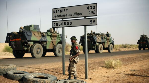 This Feb. 6, 2013, file photo shows French armoured vehicles heading towards the Niger border before making a left turn north in Gao, northern Mali.  - Sputnik International