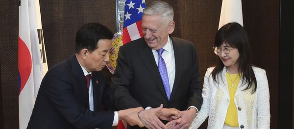 (File) U.S. Defense Secretary Jim Mattis, center, shakes hands with South Korea's Minister of Defense Han Minkoo, left, and Japan's Minister of Defense Tomomi Inada, right, ahead of a trilateral meeting at the 2017 International Institute for Strategic Studies (IISS) Shangri-la Dialogue, an annual defense and security forum in Asia, on Saturday, June 3, 2017 in Singapore - Sputnik International