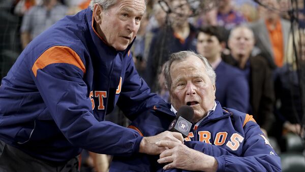 Former Presidents George H.W. Bush and George W. Bush make the play ball announcement before Game 5 of baseball's World Series against the Los Angeles Dodgers Sunday, Oct. 29, 2017, in Houston - Sputnik International