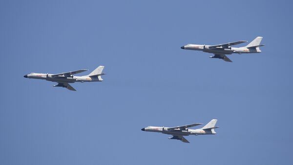 H-6K cruise missile carriers fly in formation during a parade commemorating the 70th anniversary of Japan's surrender during World War II in Beijing, Thursday, Sept. 3, 2015. The spectacle involved more than 12,000 troops, 500 pieces of military hardware and 200 aircraft of various types, representing what military officials say is the Chinese military's most cutting-edge technology - Sputnik International