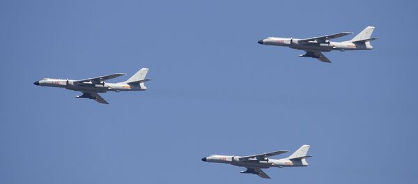 H-6K cruise missile carriers fly in formation during a parade commemorating the 70th anniversary of Japan's surrender during World War II in Beijing, Thursday, Sept. 3, 2015. The spectacle involved more than 12,000 troops, 500 pieces of military hardware and 200 aircraft of various types, representing what military officials say is the Chinese military's most cutting-edge technology H-6K cruise missile carriers fly in formation during a parade commemorating the 70th anniversary of Japan's surrender during World War II in Beijing, Thursday, Sept. 3, 2015. The spectacle involved more than 12,000 troops, 500 pieces of military hardware and 200 aircraft of various types, representing what military officials say is the Chinese military's most cutting-edge technology - Sputnik International