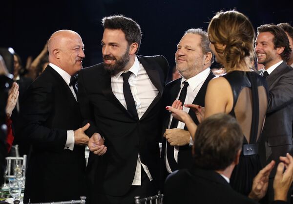 This file photo taken on January 10, 2013 shows (L-R) Co-Chairman of Creative Artists Agency Bryan Lourd, director Ben Affleck and co-chairmen of The Weinstein Company Harvey Weinstein attending the 18th Annual Critics' Choice Movie Awards held at Barker Hangar in Santa Monica, California This file photo taken on January 10, 2013 shows (L-R) Co-Chairman of Creative Artists Agency Bryan Lourd, director Ben Affleck and co-chairmen of The Weinstein Company Harvey Weinstein attending the 18th Annual Critics' Choice Movie Awards held at Barker Hangar in Santa Monica, California - Sputnik International