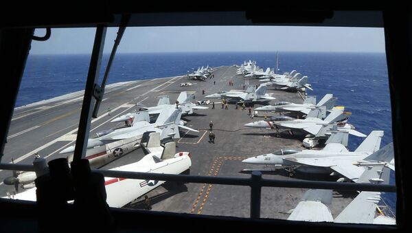 Fighter jets on board the U.S. Navy aircraft carrier USS Carl Vinson (CVN 70) are prepared for patrols off the disputed South China Sea Friday, March 3, 2017 - Sputnik International
