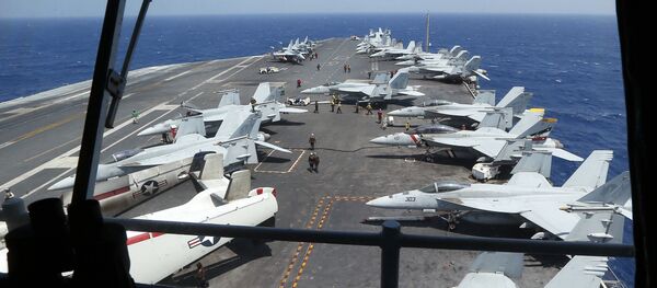 Fighter jets on board the U.S. Navy aircraft carrier USS Carl Vinson (CVN 70) are prepared for patrols off the disputed South China Sea Friday, March 3, 2017 - Sputnik International