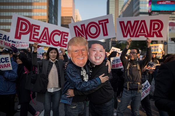 Demostrators dressed as North Korean leader Kim Jong-Un (R) and US President Donald Trump (L) embrace during a peace rally in Seoul on November 5, 2017 Demostrators dressed as North Korean leader Kim Jong-Un (R) and US President Donald Trump (L) embrace during a peace rally in Seoul on November 5, 2017 - Sputnik International