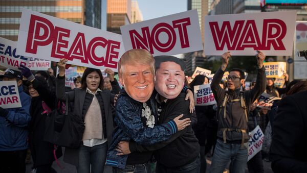 Demostrators dressed as North Korean leader Kim Jong-Un (R) and US President Donald Trump (L) embrace during a peace rally in Seoul on November 5, 2017 - Sputnik International