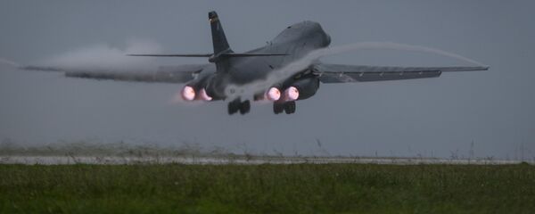 U.S. Air Force B-1B Lancer bomber assigned to 37th Expeditionary Bomb Squadron, deployed from Ellsworth Air Force Base, South Dakota, takes off from Andersen Air Force Base, Guam, to fly a mission with two Koku Jieitai (Japan Air Self-Defense Force) F-15s, Sept. 9, 2017 - Sputnik International