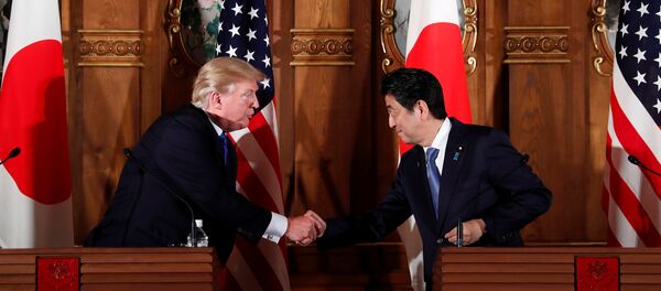 U.S. President Donald Trump and Japan's Prime Minister Shinzo Abe shake hands during a news conference at Akasaka Palace in Tokyo, Japan, November 6, 2017 U.S. President Donald Trump and Japan's Prime Minister Shinzo Abe shake hands during a news conference at Akasaka Palace in Tokyo, Japan, November 6, 2017 - Sputnik International