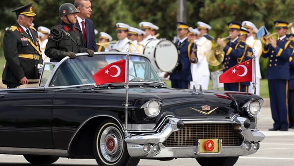 Turkish President Recep Tayyip Erdogan, right, and Chief of Staff Gen. Necdet Ozel, left, inspect the military on Victory Day in Ankara, Turkey, Saturday, Aug. 30, 2014. - Sputnik International