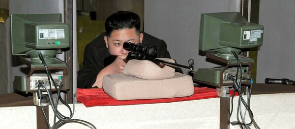 North Korean leader Kim Jong-Un aims a rifle at the Sporting Bullet Factory (File) - Sputnik International
