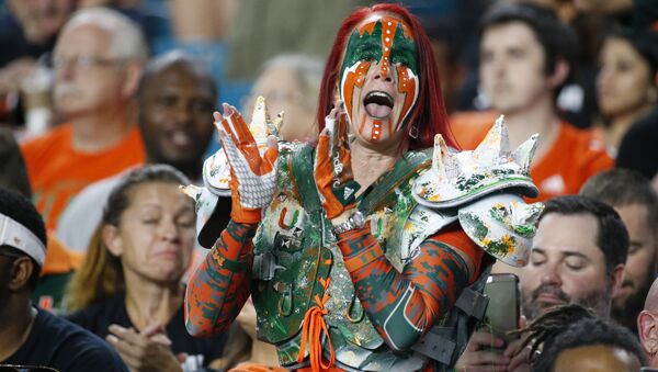 A Miami fan cheers before the start of an NCAA College football game between Miami and Virginia Tech, Saturday, Nov. 4, 2017 in Miami Gardens, Fla. - Sputnik International