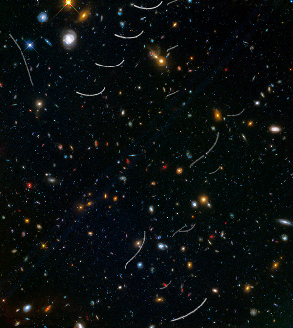 This Hubble photo of a random patch of sky is part of a survey called Frontier Fields. Asteroid trails appear as curved or S-shaped streaks. This Hubble photo of a random patch of sky is part of a survey called Frontier Fields. Asteroid trails appear as curved or S-shaped streaks. - Sputnik International