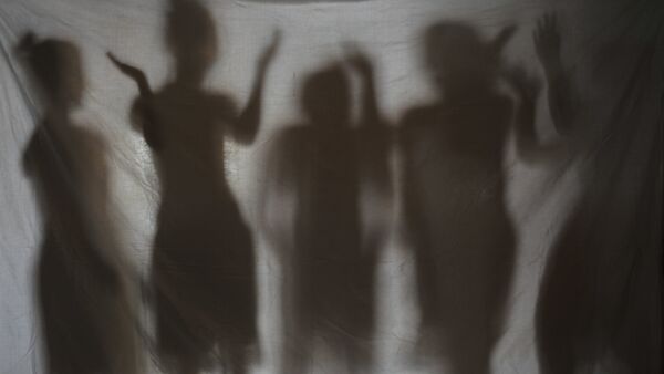 The shadows of five teenage girls rescued from a cyber sex den is seen in this photo taken at Preda Foundation office on December 2, 2010 in Olongapo City - Sputnik International