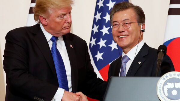 U.S. President Donald Trump and South Korea’s President Moon Jae-in shake hands at a news conference at South Korea’s presidential Blue House in Seoul, South Korea, November 7, 2017 - Sputnik International
