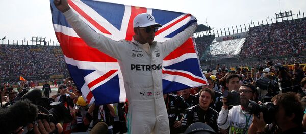 Mercedes' Lewis Hamilton celebrates after winning the World Championship Mercedes' Lewis Hamilton celebrates after winning the World Championship - Sputnik International