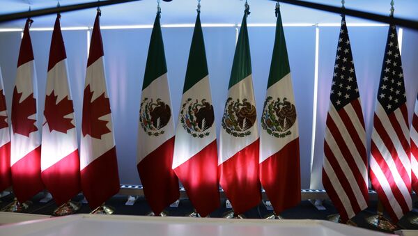 National flags representing Canada, Mexico, and the US are lit by stage lights at the North American Free Trade Agreement, NAFTA, renegotiations, in Mexico City, Tuesday, Sept. 5, 2017. - Sputnik International