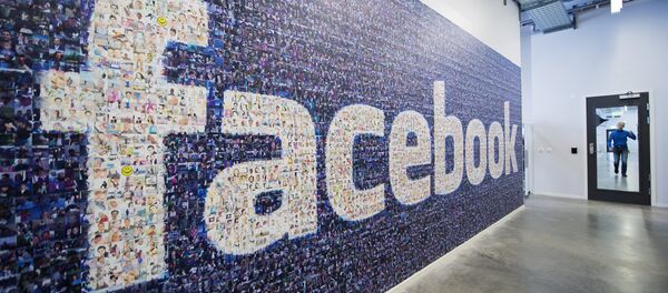 A big logo created from pictures of Facebook users worldwide is pictured in the company's Data Center, its first outside the US on November 7, 2013 in Lulea, in Swedish Lapland - Sputnik International