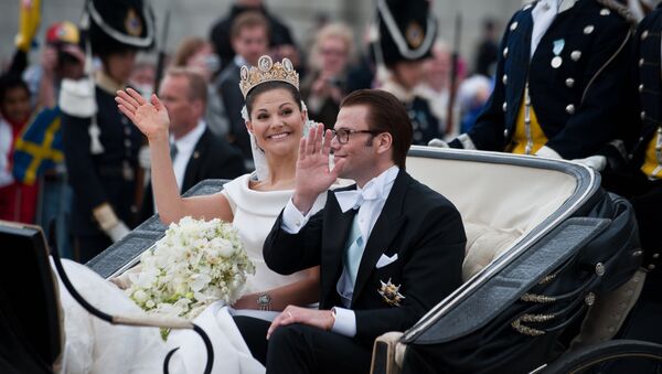 Crown Princess Victoria of Sweden, Duchess of Vastergotland, and her husband Prince Daniel, Duke of Vastergotland wave from a carriage following their wedding at the cathedral on June 19, 2010 in Stockholm - Sputnik International