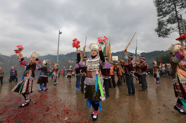 People celebrating the traditional Miao Minority Mang Hao (Mang means mask and Hao means god) festival in Rongan, southwest China's Guangxi province. (File) - Sputnik International