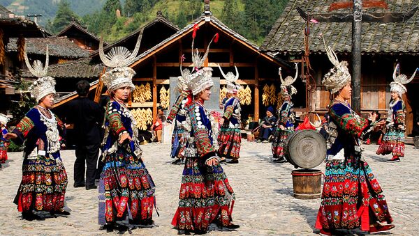People of the Miao ethnic minority dancing in tranditional costume in China's southwestern Guizhou province - Sputnik International
