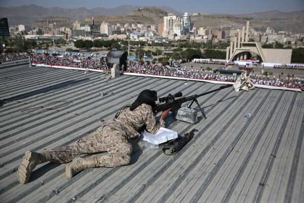 A Houthi Shiite sniper keeps watch over a rally to mark the third anniversary of the Houthis' takeover of the Yemeni capital, in Sanaa. A Houthi Shiite sniper keeps watch over a rally to mark the third anniversary of the Houthis' takeover of the Yemeni capital, in Sanaa. - Sputnik International