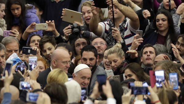 People photograph and film Pope Francis with their smartphone as he arrives for his weekly general audience in Paul VI Hall at the Vatican, Wednesday, Dec. 21, 2016 - Sputnik International